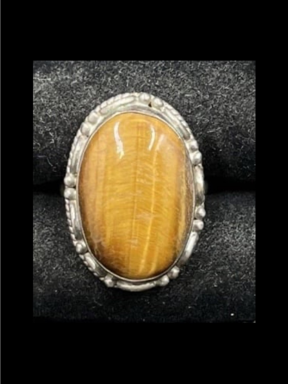 Oval Cabochon Tiger's Eye Gemstone Set In A Sterling Silver Setting Size 5